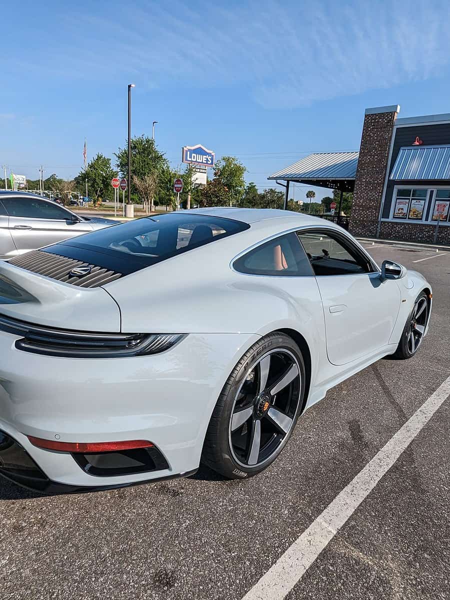 White Porsche 911 in the shop lot