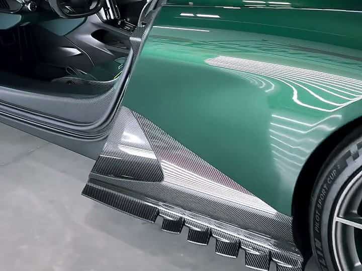 The carbon sill and green flank of the Aston Martin Valhalla, coated in Autobahn Härt